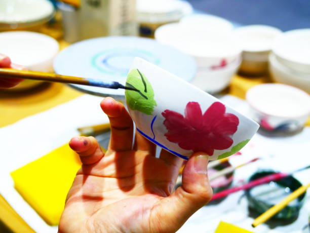Close-up painting of a ceramic bowl with flower